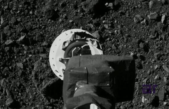 Close-up of robotic arm collecting soil samples on rocky surface, representing NexCorp Labs’ advancements in aerospace technology, space research, and infrastructure led by Atul Raj.
